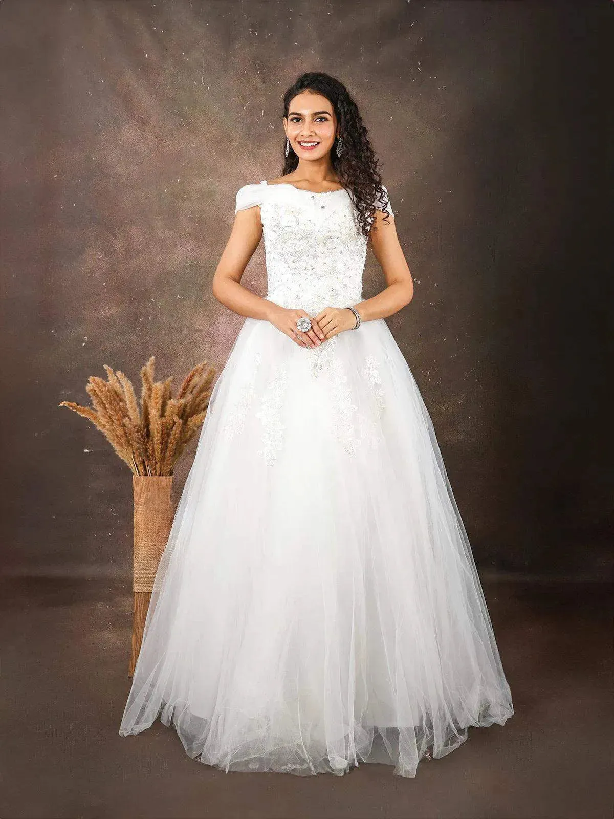 White Net Gown Embellished with Floral Thread Work Embroidery